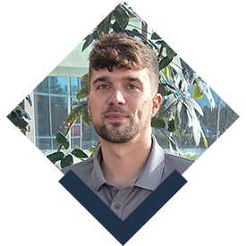 photo of Ode Custom Renovations Project Crew Lead, Nick Senauskas, framed in a diamond cutout with a stylized thicker bottom portion in navy blue